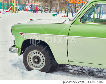 Vintage.Old retro green car in winter back yard Vintage.Old retro green car in winter back yard 137807402