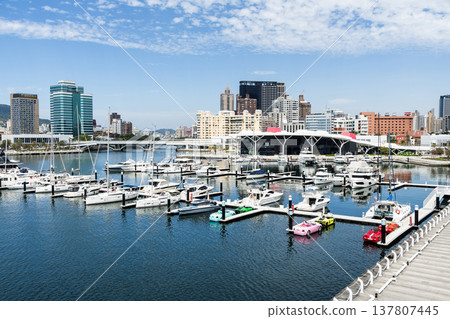 View of Argo Yacht Marina at Glory Pier of Kaohsiung Port, Taiwan. with the Coral Zone building of Kaohsiung Music Center. View of Argo Yacht Marina at Glory Pier of Kaohsiung Port, Taiwan. with the Coral Zone building of Kaohsiung Music Center. 137807445