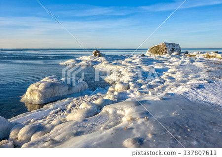 Icy Seascape, Coastal Fortification Ruins in Winter on Baltic Sea Shore, Liepaja Latvia Icy Seascape, Coastal Fortification Ruins in Winter on Baltic Sea Shore, Liepaja Latvia 137807611