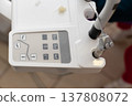 Modern dental equipment control panel with user-friendly interface in a well-lit dental clinic during a bright afternoon 137808072