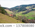 Rolling hills and quaint villages create a tranquil landscape in the quiet countryside of Germany during a crisp spring day 137808080
