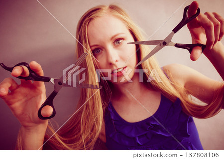 Girl with scissors for haircutting 137808106