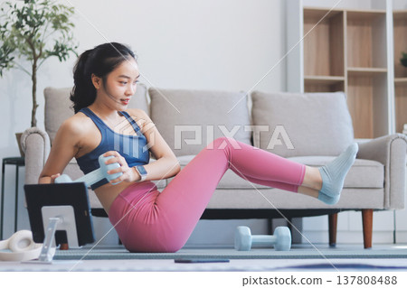 Young Asian sporty attractive people practicing yoga lesson with instructor. Asia group of women exercising healthy lifestyle in fitness studio. Sport activity, gymnastics or ballet dancing class. Young Asian sporty attractive people practicing yoga lesson with instructor. Asia group of women exercising healthy lifestyle in fitness studio. Sport activity, gymnastics or ballet dancing class. 137808488