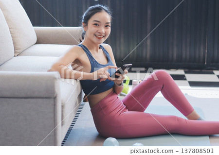 Young Asian sporty attractive people practicing yoga lesson with instructor. Asia group of women exercising healthy lifestyle in fitness studio. Sport activity, gymnastics or ballet dancing class. Young Asian sporty attractive people practicing yoga lesson with instructor. Asia group of women exercising healthy lifestyle in fitness studio. Sport activity, gymnastics or ballet dancing class. 137808501