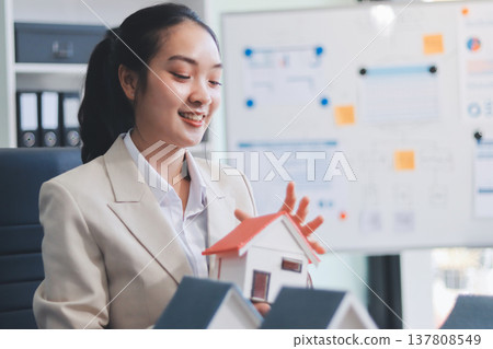 real estate agent home miniature model on documents sale and purchase of apartment notarial deed real estate agent home miniature model on documents sale and purchase of apartment notarial deed 137808549