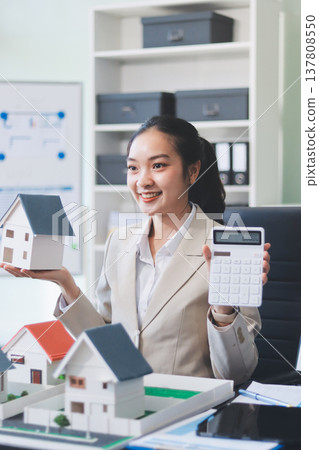 real estate agent home miniature model on documents sale and purchase of apartment notarial deed real estate agent home miniature model on documents sale and purchase of apartment notarial deed 137808550