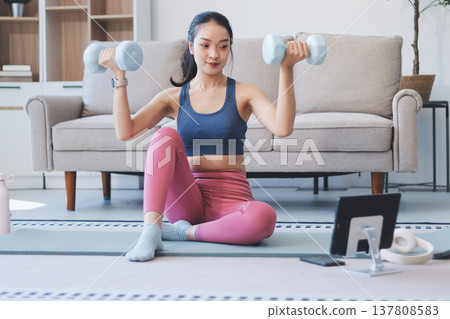 Young Asian sporty attractive people practicing yoga lesson with instructor. Asia group of women exercising healthy lifestyle in fitness studio. Sport activity, gymnastics or ballet dancing class. Young Asian sporty attractive people practicing yoga lesson with instructor. Asia group of women exercising healthy lifestyle in fitness studio. Sport activity, gymnastics or ballet dancing class. 137808583