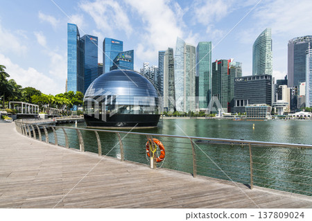 Building view of the Apple Marina Bay Sands with a skyscraper background, Singapore, is the first Apple store in the world surrounded by water. Building view of the Apple Marina Bay Sands with a skyscraper background, Singapore, is the first Apple store in the world surrounded by water. 137809024