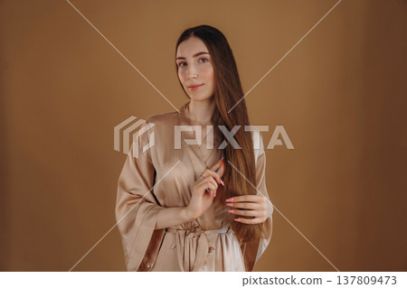 Young woman is against background Young woman is against background 137809473