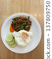 Spicy pork stir fry fried egg white rice cucumber slice thai food asian cuisine street food lunch dinner comfort food homemade savory chili sauce green bean cooked meat protein side dish vegetable 137809750