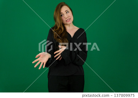 Different emotions of a woman's pose in black on a green background Different emotions of a woman's pose in black on a green background 137809975