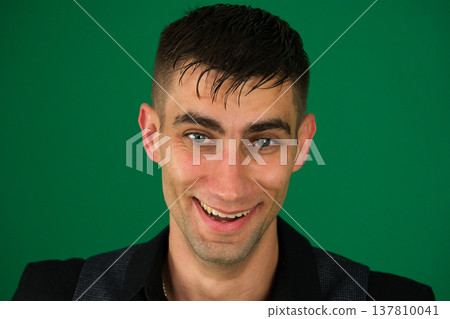 Smiling young man young handsome hicpanic man laughing happily with arms crossed, with a relaxed, positive and satisfied pose Smiling young man young handsome hicpanic man laughing happily with arms crossed, with a relaxed, positive and satisfied pose 137810041