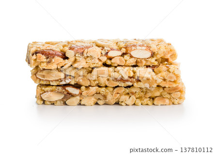 Crunchy Peanut Nut Bars Stacked Energy Snack Bars With Honey Glaze On White Background Crunchy Peanut Nut Bars Stacked Energy Snack Bars With Honey Glaze On White Background 137810112