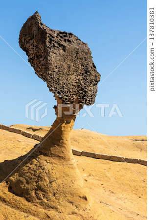 Beautiful Queen's Head of the Yehliu Geopark. Yehliu is a cape located in Wanli, New Taipei City, Taiwan. 137810381