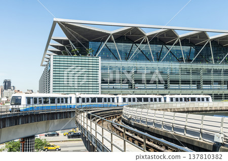 A train on the Wenhu or Brown Line of the Taipei MRT passes by the Taipei Nangang Exhibition Center Hall 2. A train on the Wenhu or Brown Line of the Taipei MRT passes by the Taipei Nangang Exhibition Center Hall 2. 137810382