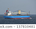 A cargo ship sailing on a cloudy sea. 137810481