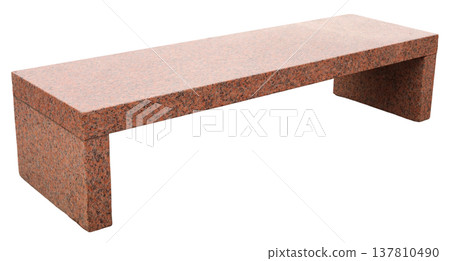 A granite bench sits alone on a white background. This bench can be used in various settings like gardens or homes. It has a simple and functional design for sitting 137810490