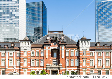 Building view of the Tokyo Station. It's a major inter-city rail terminal in Chiyoda, Tokyo, Japan. located in the Marunouchi business district.  137810572