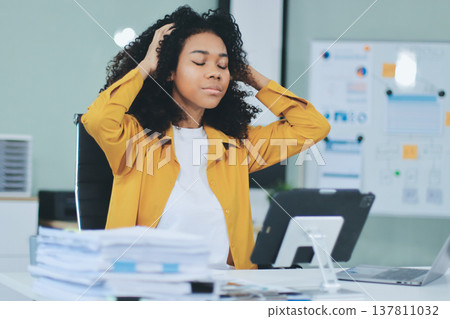 Businesswoman get stressed and headache while having a problem at work in office 137811032