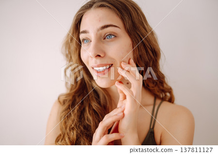 Woman no make up with red spots on her face. Health problem, skin diseases. Medicine and cosmetology Woman no make up with red spots on her face. Health problem, skin diseases. Medicine and cosmetology 137811127