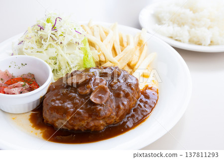 Delicious hamburger steak with demi-glace sauce and rice Delicious hamburger steak with demi-glace sauce and rice 137811293