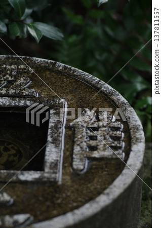 A water basin that teaches the importance of contentment. A water basin that teaches the importance of contentment. 137811557
