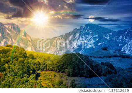 beautiful countryside. beautiful countryside. day meet night. sun and moon over wonderful springtime landscape in mountains. grassy field and rolling hills. rural scenery with steep forested slopes. beautiful countryside. beautiful countryside. day meet night. sun and moon over wonderful springtime landscape in mountains. grassy field and rolling hills. rural scenery with steep forested slopes. 137812629