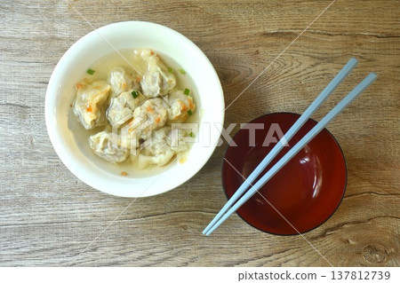 Chinese dumpling topping slice red barbecue pork with clear soup on bowl Chinese dumpling topping slice red barbecue pork with clear soup on bowl 137812739
