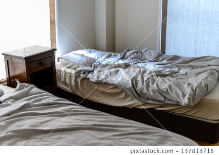 A messy twin bedroom A messy twin bedroom 137813718
