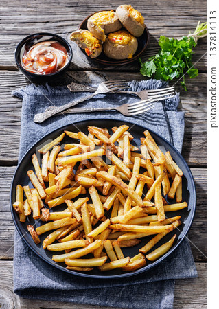 Crispy french fries on a plate with dipping sauce Crispy french fries on a plate with dipping sauce 137814113