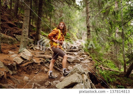 Young woman with backpack traveling outdoors. Hiking, active lifestyle. Young woman with backpack traveling outdoors. Hiking, active lifestyle. 137814813