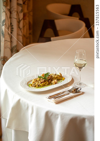 Pasta with shrimp in creamy pesto sauce Pasta with shrimp in creamy pesto sauce 137815563