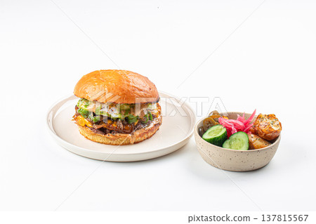 Burger with salad bowl on plate 137815567
