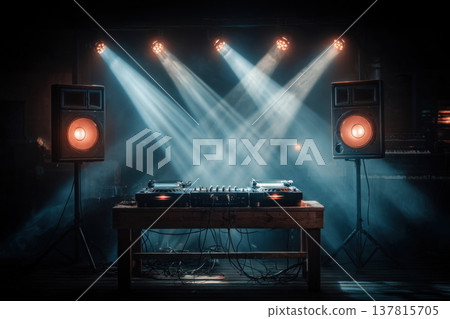 A table with music mixing equipment. Bright beams of light, a black background A table with music mixing equipment. Bright beams of light, a black background 137815705