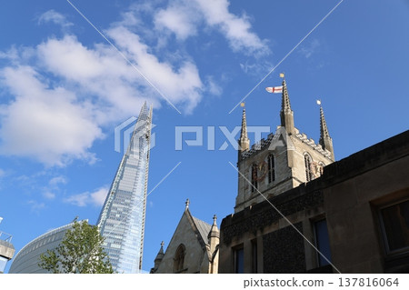 London's skyscrapers, The Shard and churches, stretching against the blue sky. London's skyscrapers, The Shard and churches, stretching against the blue sky. 137816064