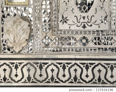 Close detail of Jaipur palace wall reveals intricate mirror mosaic and floral ornament pattern. 137816196