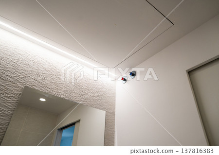 Minimalist bathroom interior design showcasing contemporary wall texture, clean lines, and modern LED lighting creating a serene atmosphere in a renovated home 137816383
