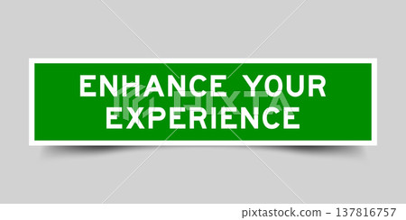 Green color square shape sticker label with word enhance your experience on gray background Green color square shape sticker label with word enhance your experience on gray background 137816757