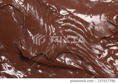Chocolate nut paste as background, texture,macro. Chocolate nut paste as background, texture,macro. 137817796
