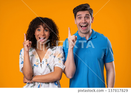 Creative Idea, Young Couple Woman and Man, Eureka Moment, Pointing Fingers Up Creative Idea, Young Couple Woman and Man, Eureka Moment, Pointing Fingers Up 137817829