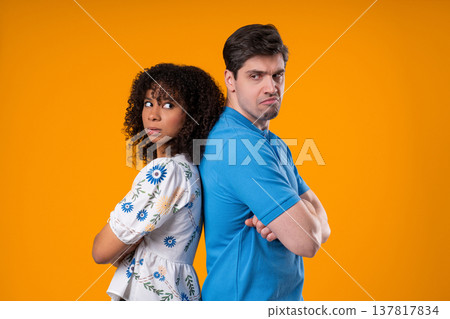 Interracial Offended Couple. Quarreling, Standing Back. Selfishness, Resentment Interracial Offended Couple. Quarreling, Standing Back. Selfishness, Resentment 137817834