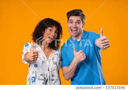 Positive Woman And Man With Hand Sign Like, Thumbs Up Gesture. Couple On Yellow 137817840