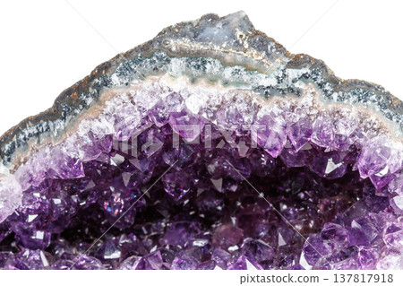 Macro Mineral Stone Amethysts in the rock on a white background Macro Mineral Stone Amethysts in the rock on a white background 137817918