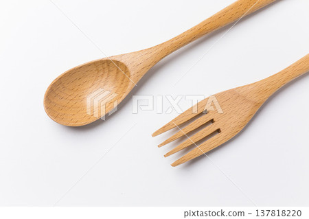 Wooden spoon and fork on a white background 137818220