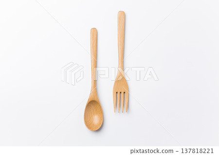 Wooden spoon and fork on a white background 137818221