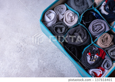 Decluttering concept. Organizing sock storage Decluttering concept. Organizing sock storage 137818401
