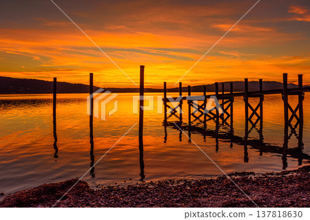 Sunset over Lake Constance with wooden jetty, Reichenau Island, Baden-Wuerttemberg, Germany 137818630
