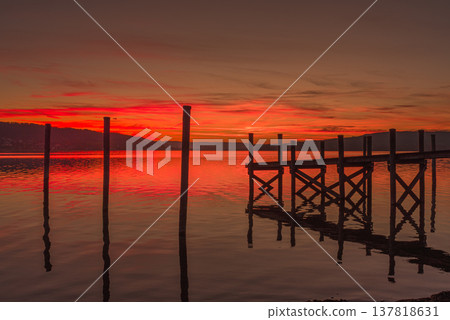 Sunset over Lake Constance with wooden jetty, Reichenau Island, Baden-Wuerttemberg, Germany Sunset over Lake Constance with wooden jetty, Reichenau Island, Baden-Wuerttemberg, Germany 137818631