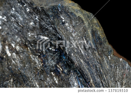Macro of a stone Stibnite mineral on a black background 137819310