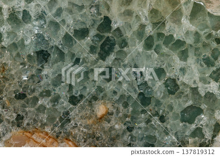 Macro stone Fluorite mineral on black background 137819312